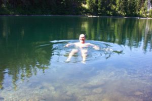Dave and a dragonfly swim in Golden Lakes