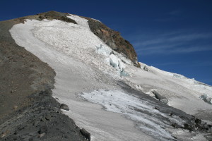 The way to the top is on the ridge left of the glacier