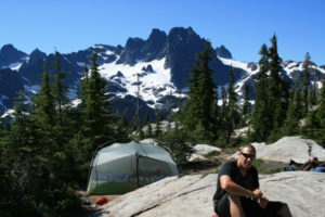 Brian at base camp, Chimney Rock in the distance.