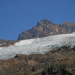 The blue ice of the Easton Glacier, with Colfax Peak in the distance.