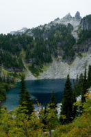 Pretty Trap Lake, and the spires above. You will be trekking across the talus fields below them on the way to the lake.